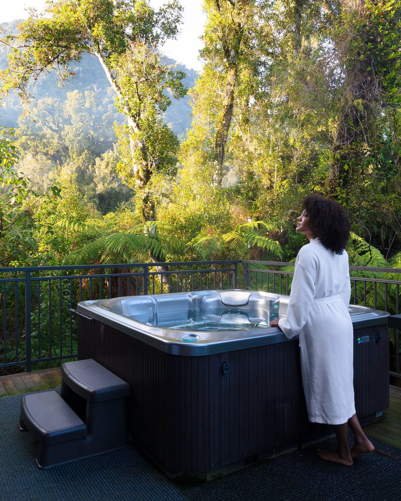 Woman In Robe Spa Pool Rainforest Retreat Women Forest Bathing By Spa Pool In Luxury Tree House In Forest Canopy Rainforest Retreat