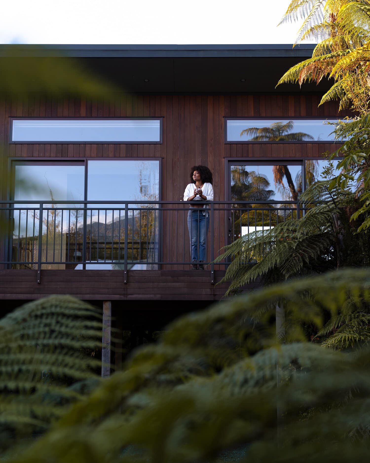 Woman Forest Bathing At Rainforest Retreat Luxury Tree House Franz Josef Glacier